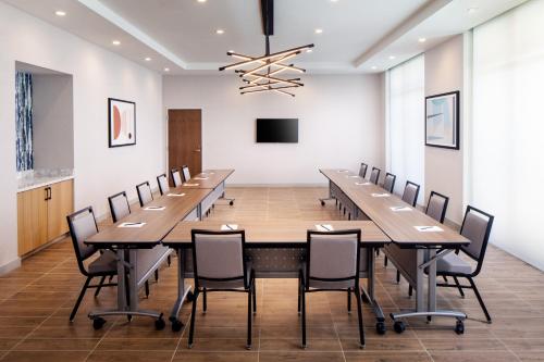 a large conference room with a long table and chairs at Hyatt House North Scottsdale in Scottsdale