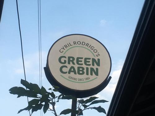 a sign for a green calium outside of a building at Visakha 6 in Colombo