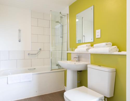 A bathroom at The Highland Hotel by Compass Hospitality