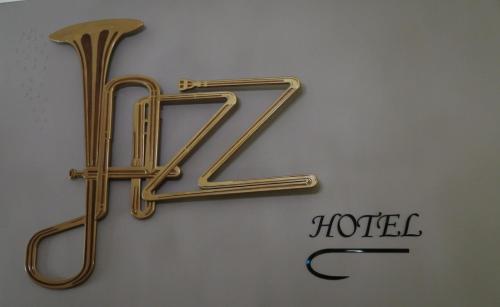 a sign for a hotel on a wall at Le Jazz Hotel in Kuwait