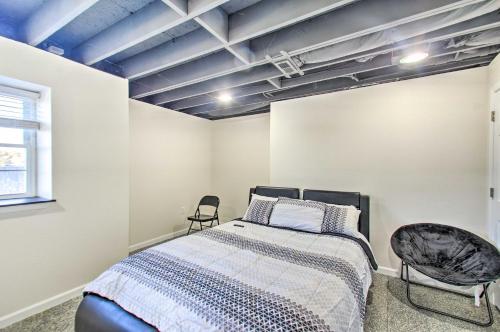 a bedroom with a bed and two chairs in it at Harrisonburg Retreat with Hot Tub about 2 Mi to JMU in Harrisonburg