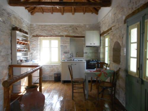 a kitchen with a table and chairs in a room at a trip to the past and the beauty in Koumeika