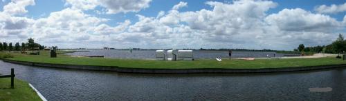 a large body of water with a body of water at Ferienhaus Segelhafen8 in Südbrookmerland