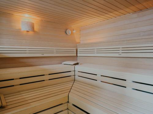 a sauna with wood paneling and a wooden ceiling at Bad Hotel Überlingen in Überlingen