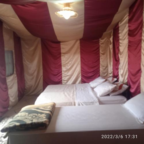 Una cama o camas en una habitación de Chegaga Berber Camps