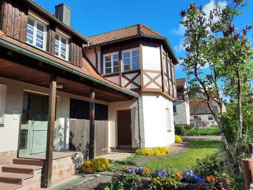 a house with a pathway leading to the front door at Ferienwohnung -Main- Ruheplatz am Wasser in Langenprozelten