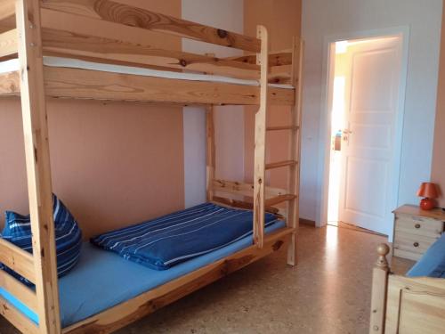a bedroom with two bunk beds in a room at Ruschmeyer in Soltau