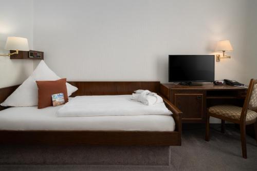 Nordsee Hotel Borkumにあるテレビまたはエンターテインメントセンター