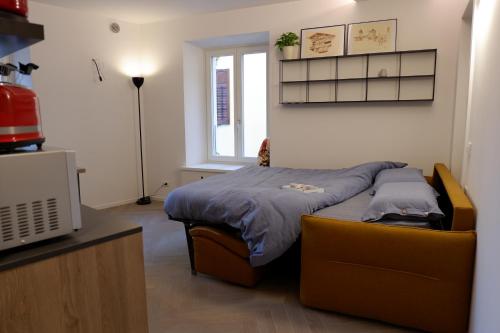 מיטה או מיטות בחדר ב-MUROS - Design Apartments in Trento