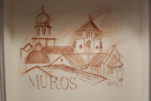 a drawing of a church and two towers on a wall at MUROS - City Modern Living in Trento in Trento
