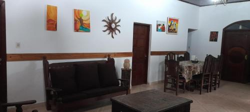 a living room with a couch and a table at Alojamiento Familiar Nobili in Puerto Iguazú