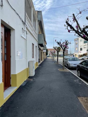 an empty street in a city with cars parked at Estúdio Albergaria in Albergaria-a-Velha