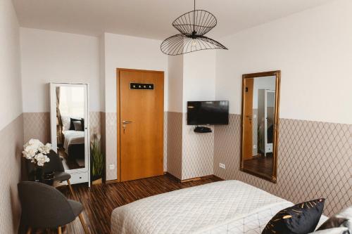 Televízia a/alebo spoločenská miestnosť v ubytovaní ClickTheFlat Gdański Center Prestige Apart Rooms