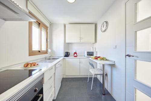 Kuchyň nebo kuchyňský kout v ubytování Sonrisa Apartments