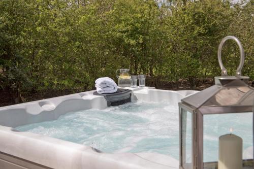 a jacuzzi tub with a sink at The Hut in Ashbourne