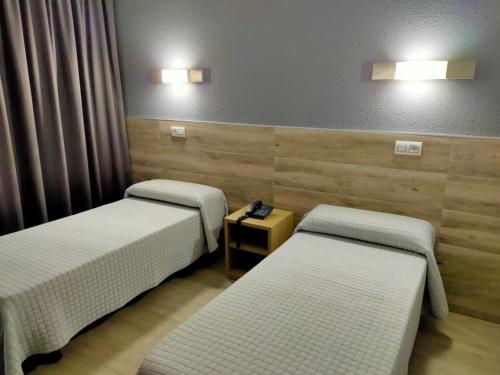 Ένα ή περισσότερα κρεβάτια σε δωμάτιο στο Hotel Reymar Playa
