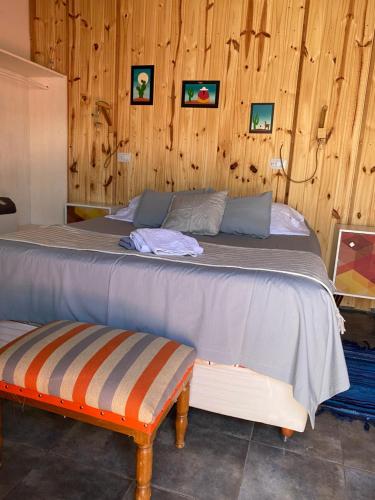 A bed or beds in a room at Hostal Asqui Pacha