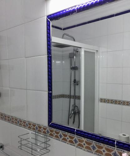 a mirror in a bathroom with a shower at El Rinconcito de Nadia in Benaocaz