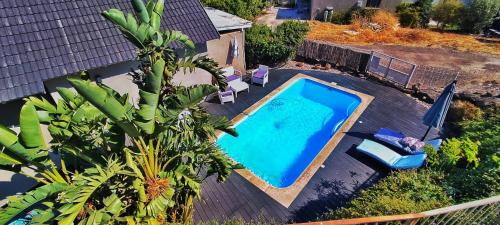 an overhead view of a swimming pool next to a house at Luna Bianca in Had Nes