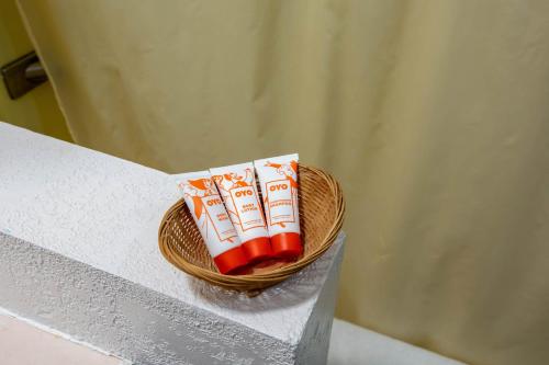 a basket of toothpaste sitting on top of a counter at OYO Hotel Chesaning Route 52 & Hwy 57 in Chesaning