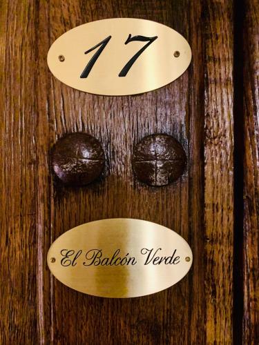 a wooden table with a clock on top of it at Posada La Torre de La Quintana in Liendo