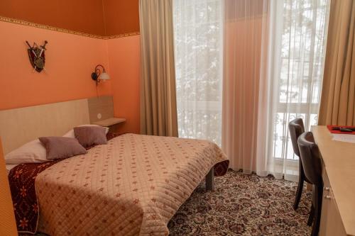 Ein Bett oder Betten in einem Zimmer der Unterkunft Hotel Pils with Self-Check in