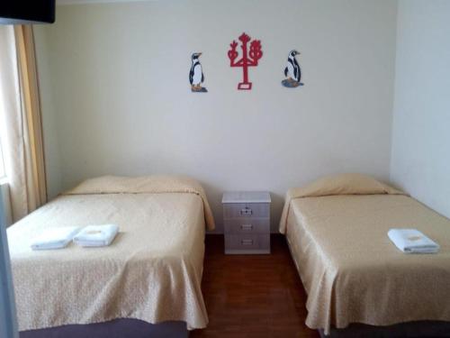 Voodi või voodid majutusasutuse Antares Paracas toas