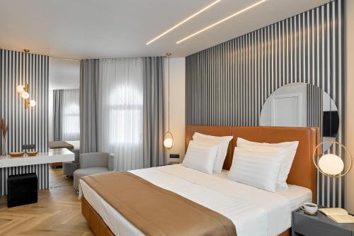 Posteľ alebo postele v izbe v ubytovaní Grand Hotel Palace