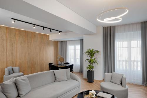 a living room with a couch and a table at Grand Hotel Palace in Thessaloniki