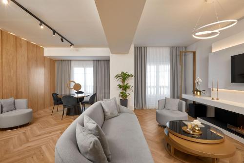 a living room with a couch and a table at Grand Hotel Palace in Thessaloniki