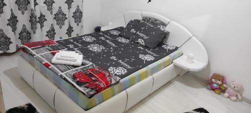a bed in a room with a black and white bedroom at kys home in Vulcan