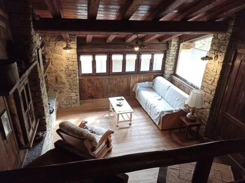 a living room with a couch and a table at Ca' de Baci' du Mattu in Mendatica