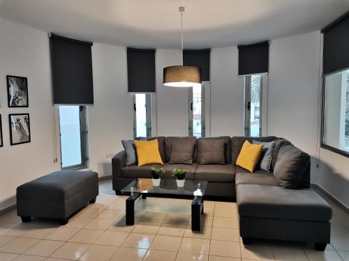 a living room with a couch and a table at City Flats 308 in Larnaca