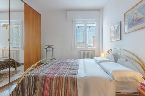 a bedroom with a large bed in a room at a 500 mt dalla Certosa Apartment in Bologna
