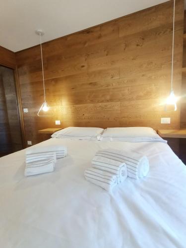 Postel nebo postele na pokoji v ubytování Regina delle Alpi
