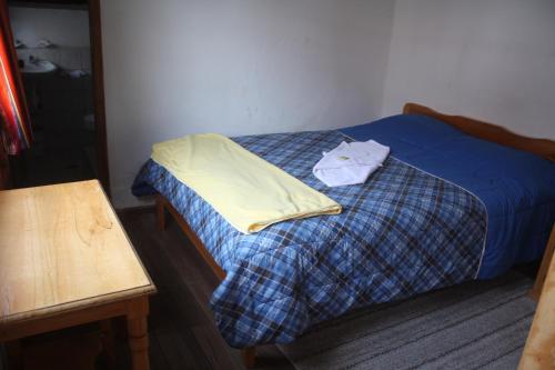 Кровать или кровати в номере Cabañas Los Volcanes