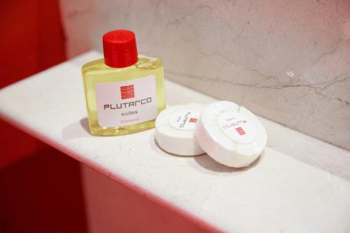 a bottle of fluid sitting on top of a counter at Plutarco Suites in Mexico City