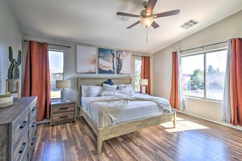 a bedroom with a bed and a ceiling fan at Avondale Oasis with Pool 5 Mi to State Farm Stadium in Avondale