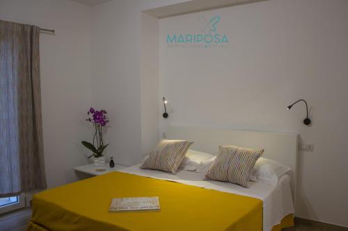 Кровать или кровати в номере Affittacamere Mariposa