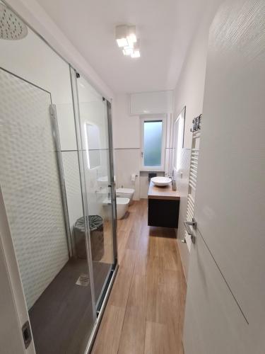 a bathroom with a walk in shower and a toilet at aria di mare in Sestri Levante
