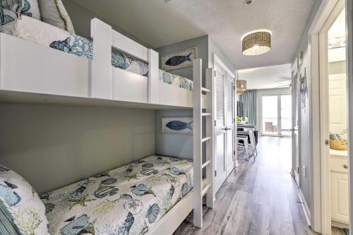 a small bedroom with a bed and a dining room at Panama City Beach Condo w/ Free Beach Service! in Panama City Beach