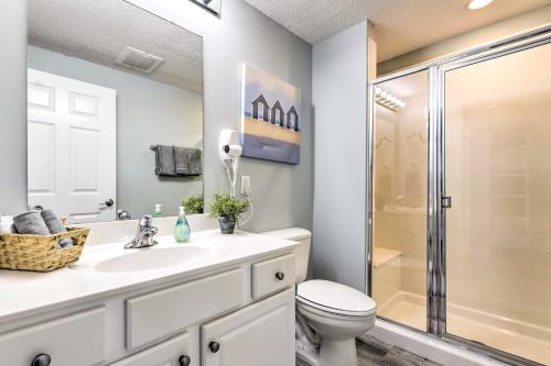 a bathroom with a toilet and a sink and a shower at Panama City Beach Condo w/ Free Beach Service! in Panama City Beach