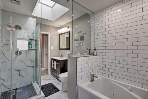 a bathroom with a tub and a toilet and a sink at Family-Friendly Getaway 11 Mi to Dtwn Philly in Philadelphia