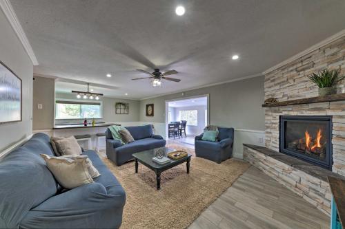 a living room with a couch and a fireplace at Mtn Escape with Deck and Views - Near Race Track! in Ruidoso Downs