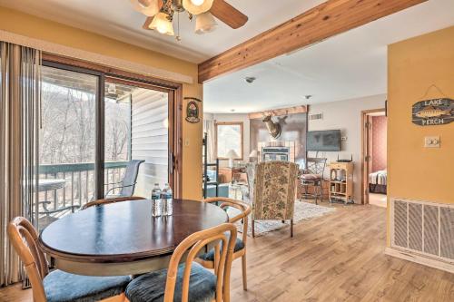 a dining room and living room with a table and chairs at Next to Shawnee Mtn Ski Area Inviting Condo! in East Stroudsburg
