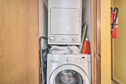 a washing machine with a microwave on top of it at Next to Shawnee Mtn Ski Area Inviting Condo! in East Stroudsburg