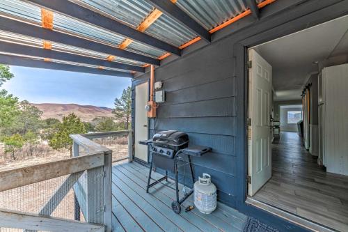 a grill on the front porch of a house at Mtn Escape with Deck and Views - Near Race Track! in Ruidoso Downs