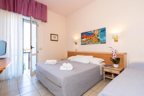 Postel nebo postele na pokoji v ubytování Hotel Tirsus