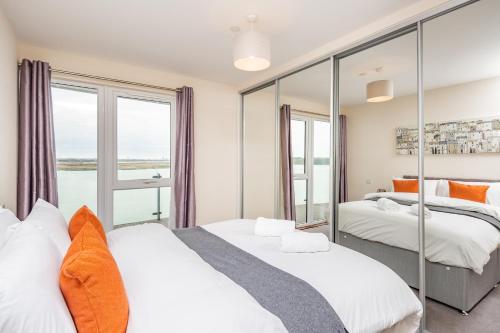 a bedroom with two beds and a large window at Kent Breath-taking VIEW 2BD/2BA with Free Parking in Kent