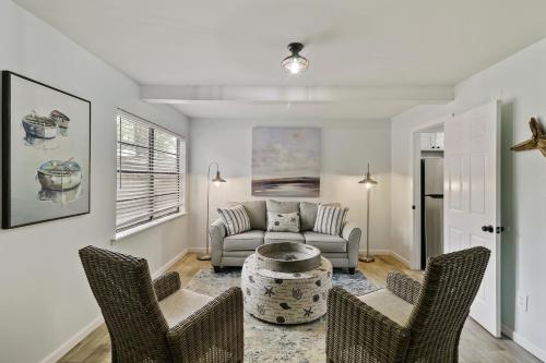 a living room with a couch and chairs at #49 Cheerful 2 BDR with Pool & Assigned 2 Parking in Hilton Head Island